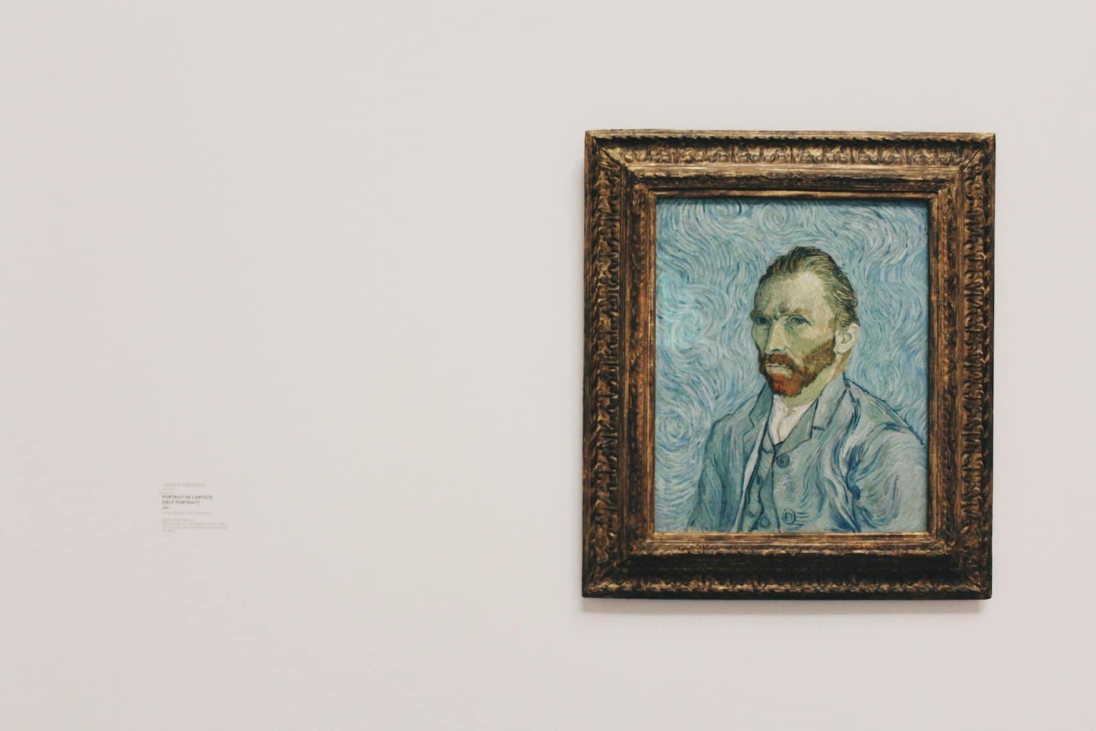 A framed painting hanging on a bright gallery wall